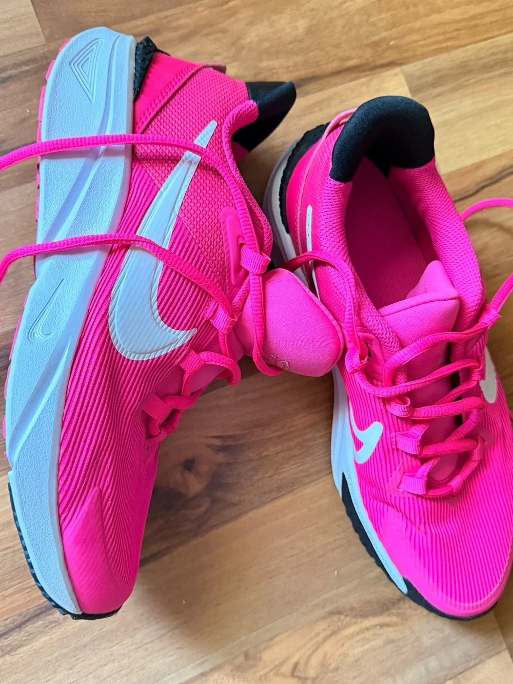 Nike Vibrant Pink Running Shoe with White Swoosh